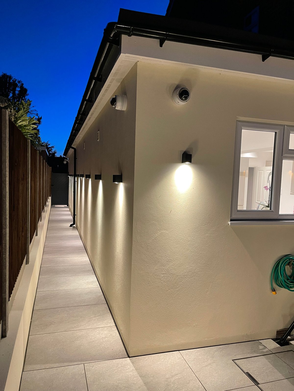 Modern house exterior with lighting and rendering