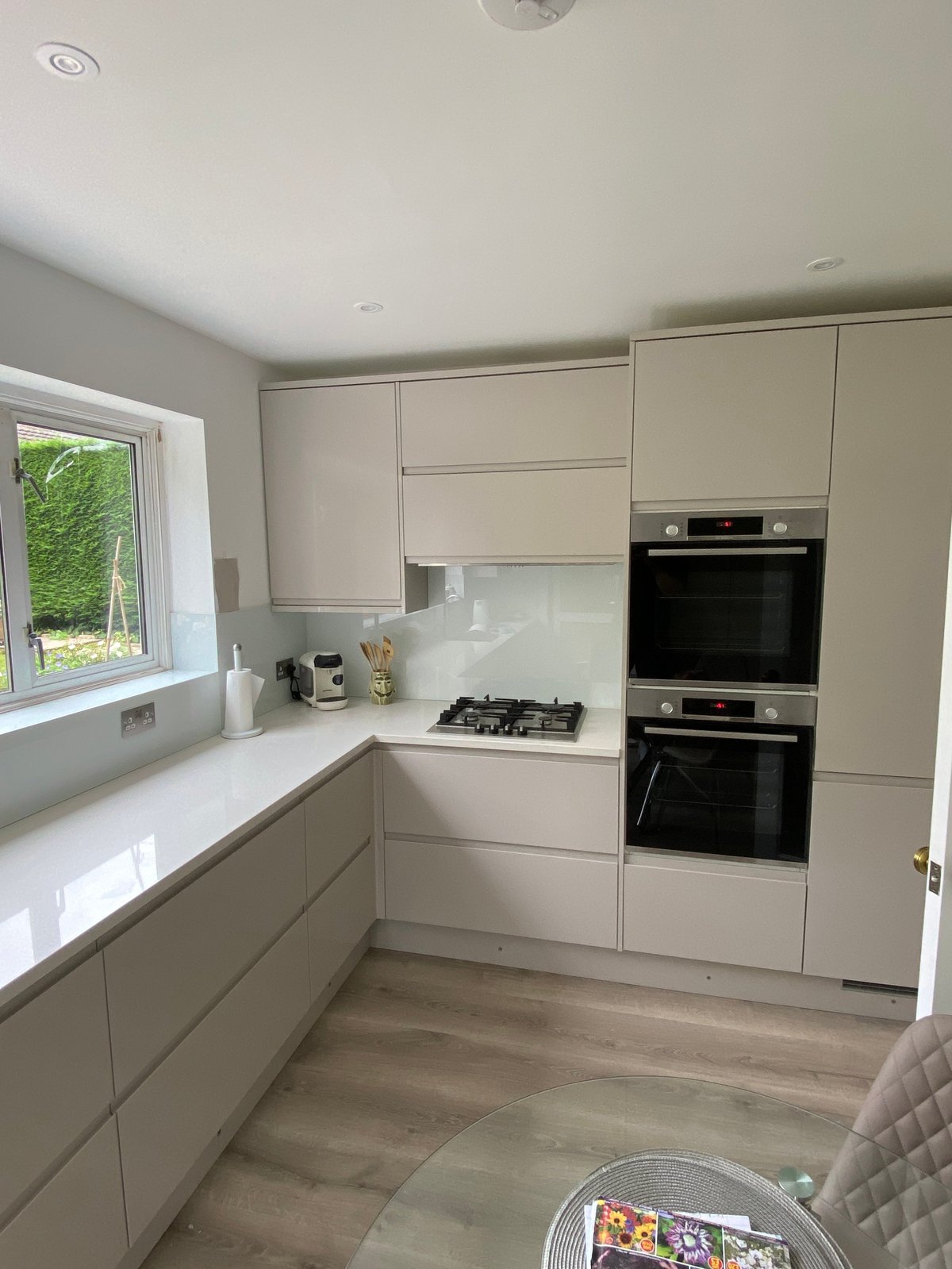 Modern kitchen with cream cabinets and integrated appliances