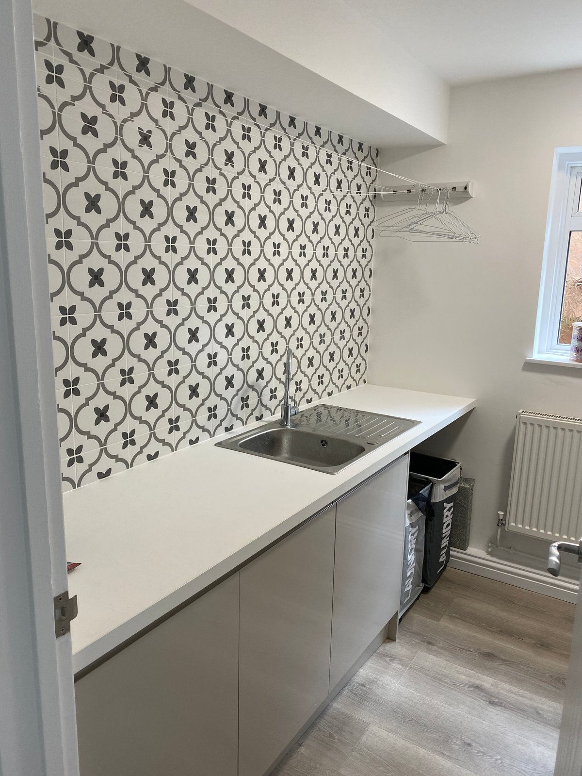 Modern kitchen with geometric patterned backsplash